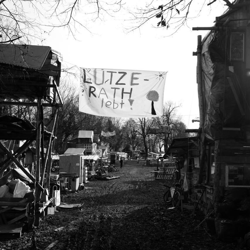 View of the squatted village Luezerath with banner "Luetzi lives"
